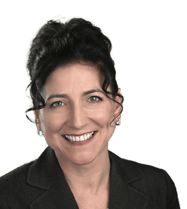 Smiling woman with dark hair in a black blazer, facing the camera (head-and-shoulders portrait).2) Portrait of a professional woman wearing a black blazer, smiling toward the camera.3) Head-and-shoulders portrait of a woman with dark hair, wearing a blazer and small earrings.4) Friendly business portrait of a woman looking at the camera in a dark blazer.5) Smiling woman in professional attire photographed against a plain background.